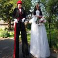 Bride and Groom stilt walkers